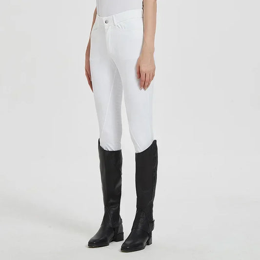 Person wearing white riding pants and black knee-high boots on a light gray background .Ghoddosh