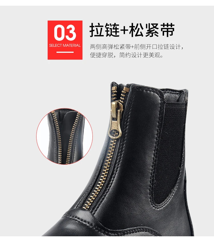 Black leather boot with a zipper on a gray surface . Ghoddosh