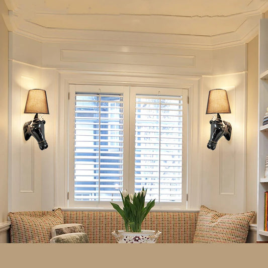 Cozy nook with a window seat, lampshades, and decorative pillows.
www.ghoddosh.com
