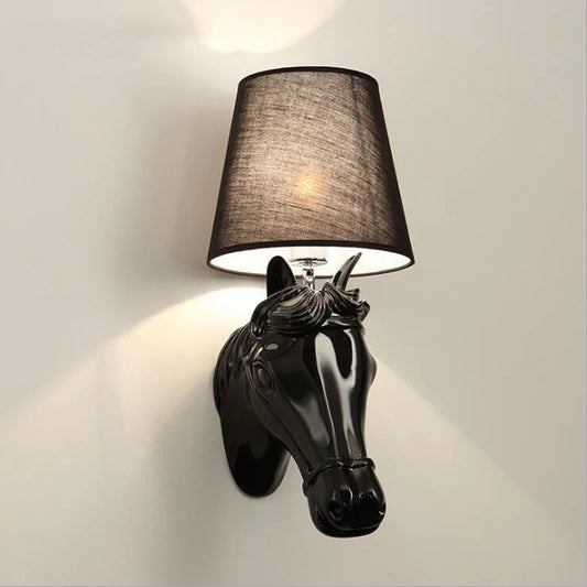 Wall-mounted lamp with horse head design and black shade on a light gray background @ ghoddosh.com