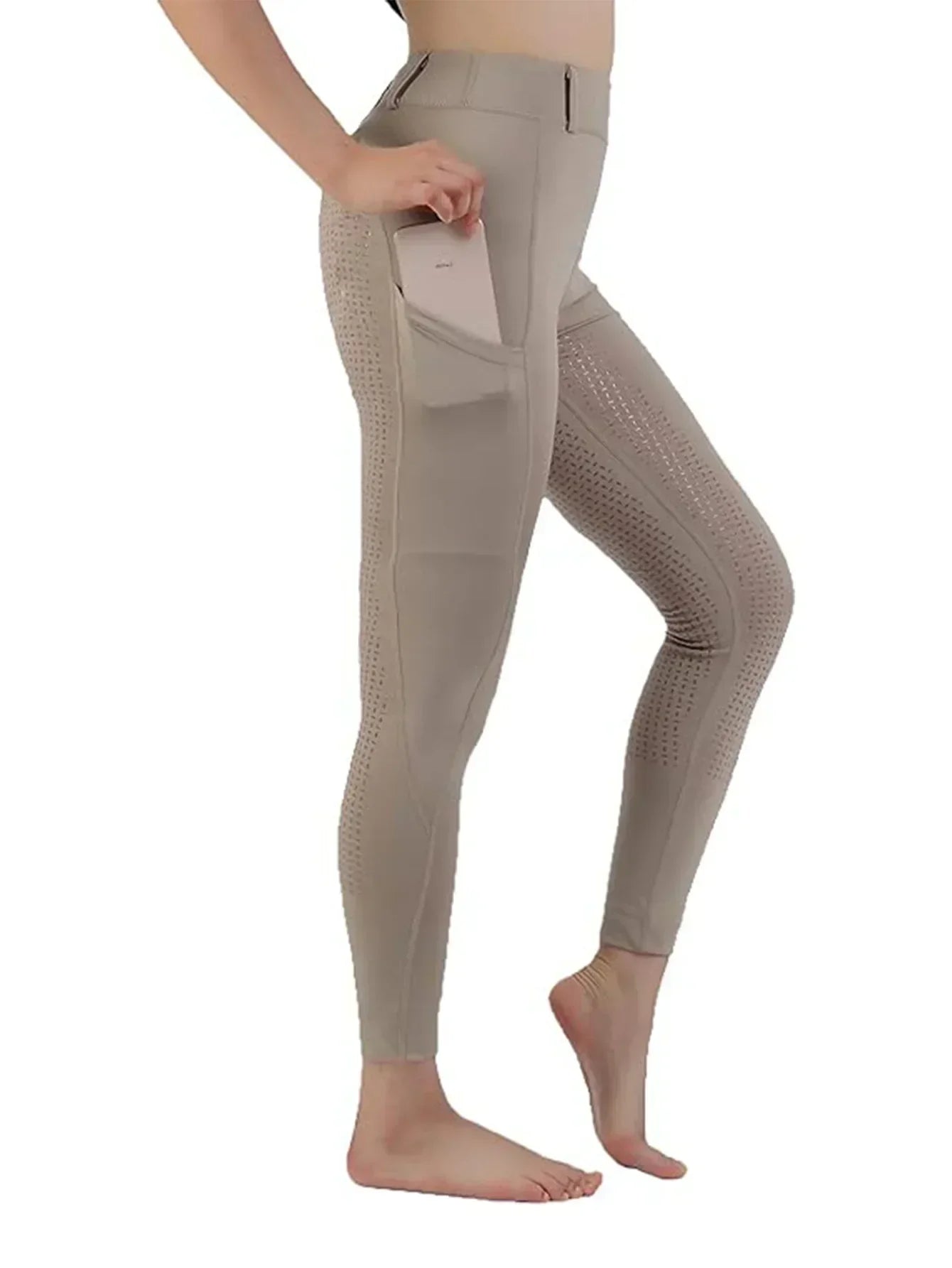 Beige leggings worn by a person on a white background .Ghoddosh 