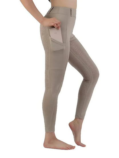 Beige leggings worn by a person on a white background .Ghoddosh 