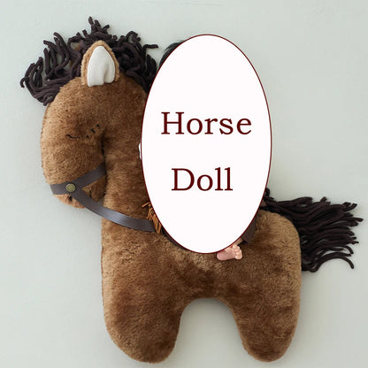Child sleeping on a plush horse toy  @ ghoddosh.com