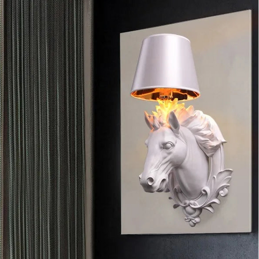 Decorative wall light with horse head design on a dark wall. @ ghoddosh.com