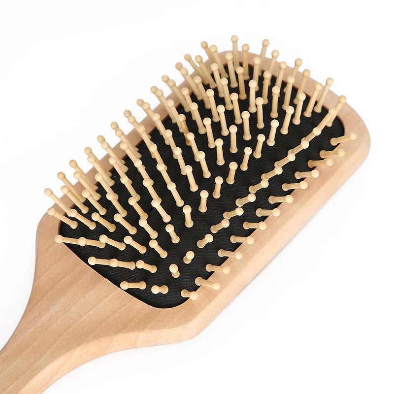 Man grooming a horse with a close-up of a wooden brush inset. @ ghoddosh.com