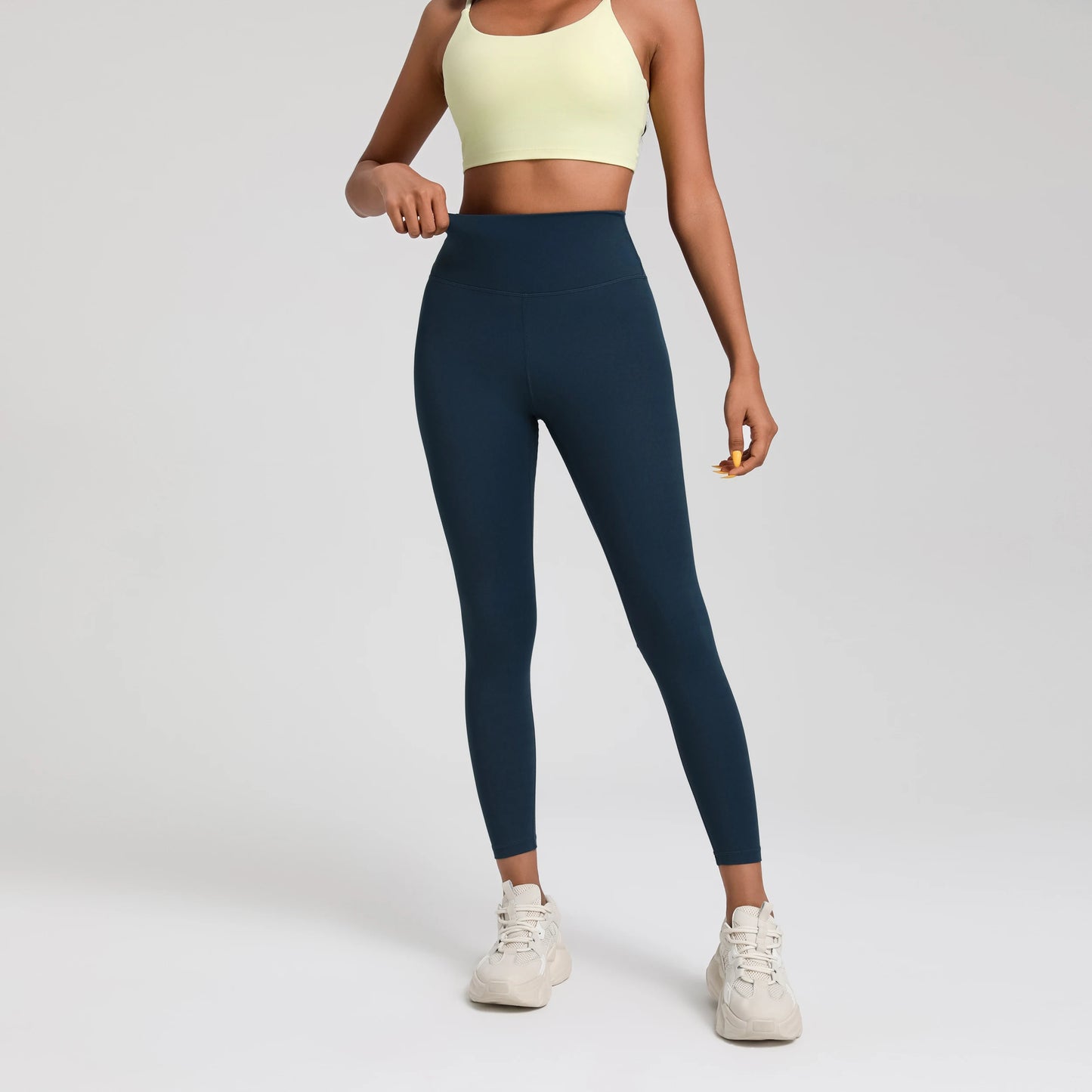A Model wearing leggings  - Solid Color Classic Soft High Waist Legging  - Women  Sports  Athletic Pants / ghoddosh.com