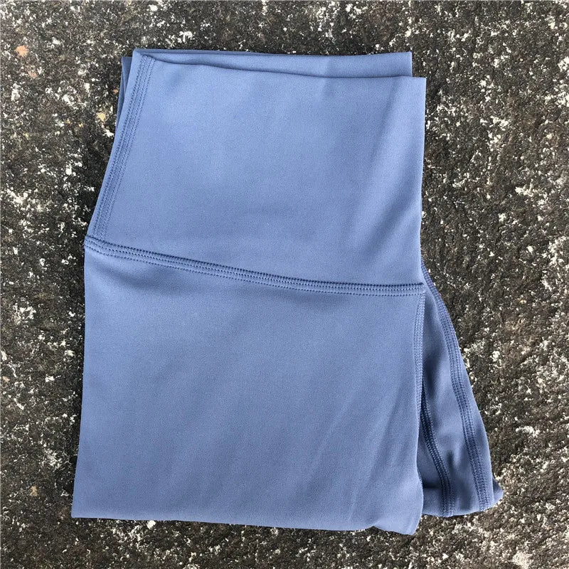 A Model wearing leggings  - Solid Color Classic Soft High Waist Legging  - Women  Sports  Athletic Pants / ghoddosh.com