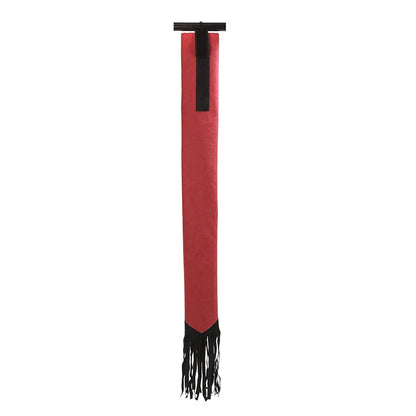 A Colored horse tail bag attached to a horse's tail, with  fringes. Ghoddosh