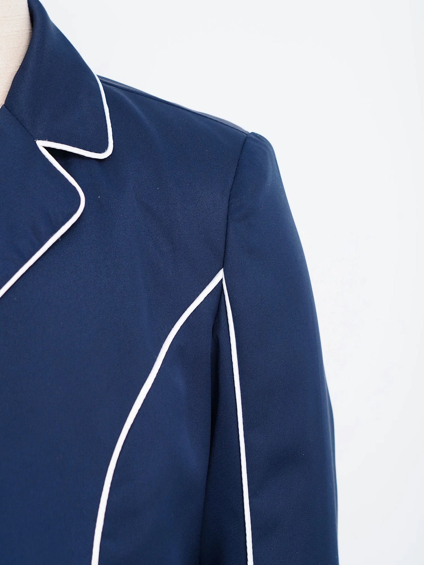 Navy blue garment with white piping on a white background @ ghoddosh.com