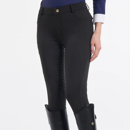 Black riding pants with patterned side panels on a white background .Ghoddosh 
