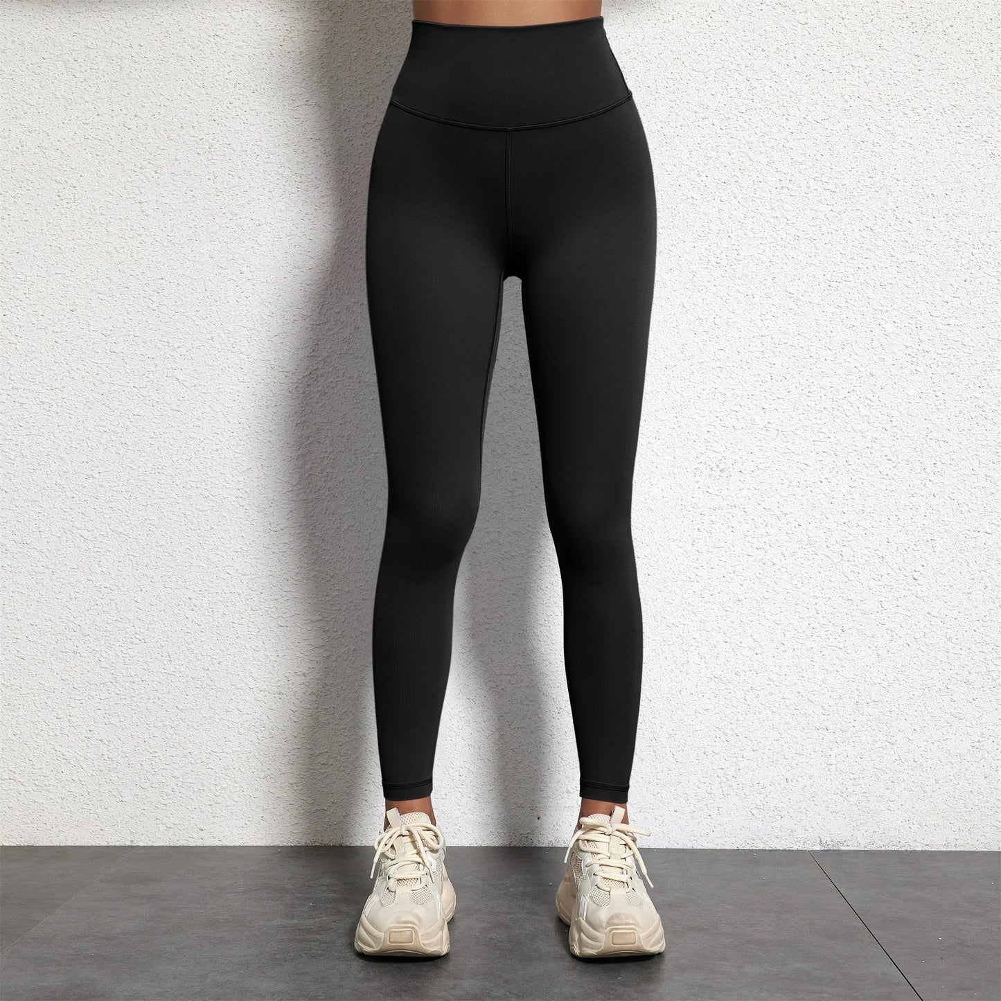 A Model wearing leggings  - Solid Color Classic Soft High Waist Legging  - Women  Sports  Athletic Pants / ghoddosh.com
